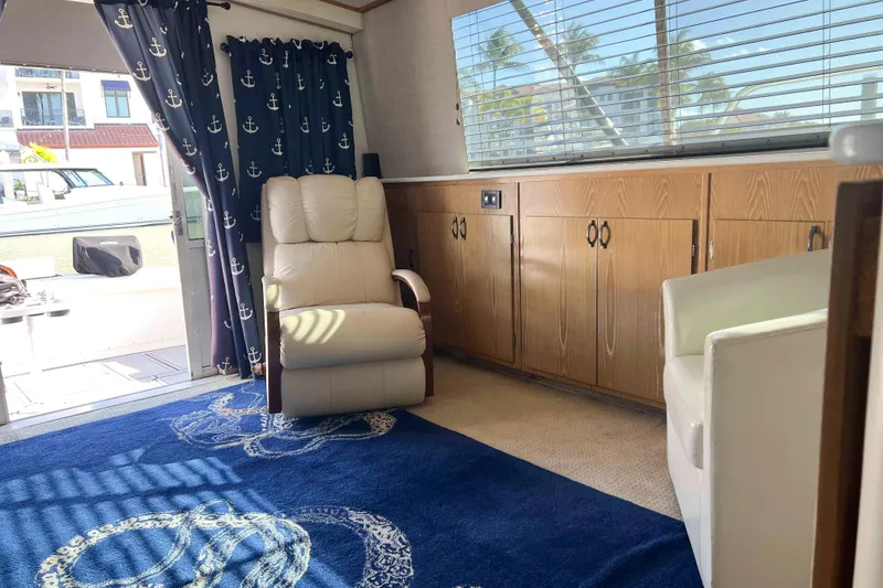 Slide: The Image of Interior of 1986 Bertram 42 Convertible yacht with nautical decor and comfortable seating. - 7