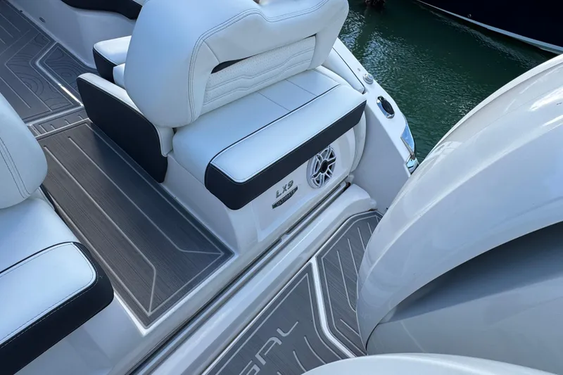 Slide: The Image of 2024 Regal LX9 boat interior with white seating and sleek design. - 11