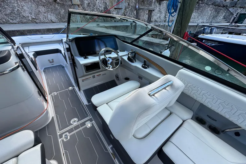 Slide: The Image of 2024 Regal LX9 boat interior with modern dashboard and luxurious seating. - 15