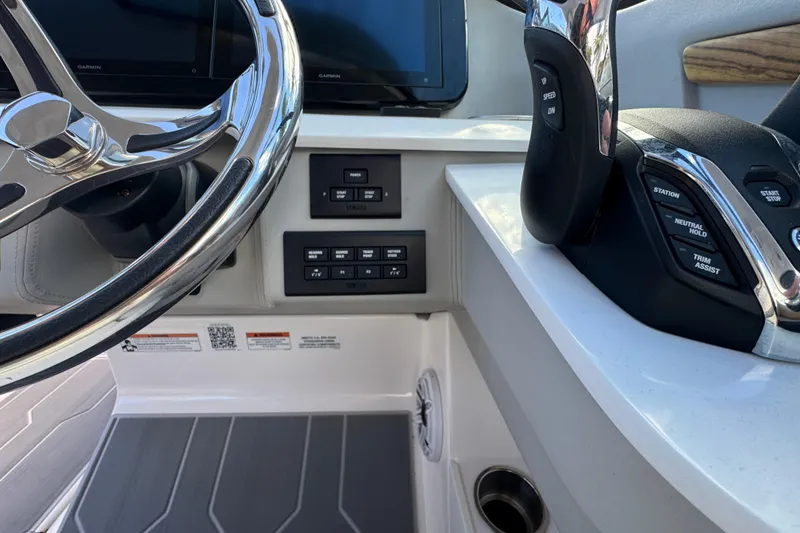 Slide: The Image of 2024 Regal LX9 boat dashboard with steering wheel and control panel. - 17