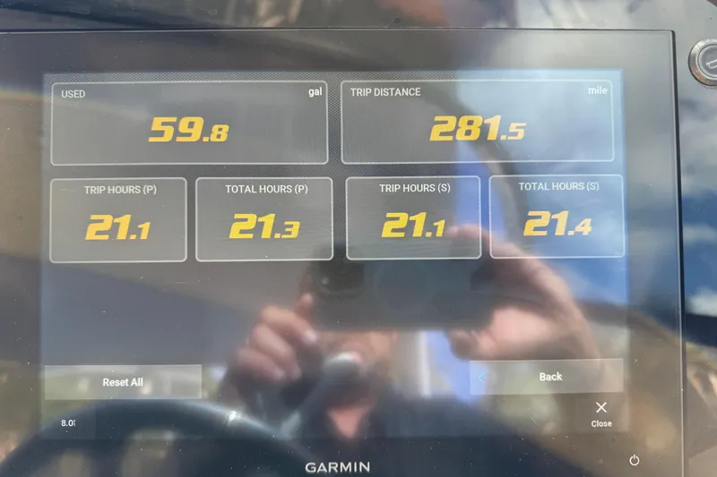 Slide: The Image of Display screen showing trip data: 59.8 gallons used, 281.5 miles traveled, 2024 Regal LX9. - 22