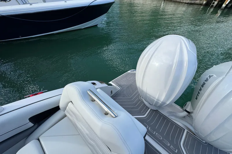 Slide: The Image of 2024 Regal LX9 boat with Yamaha engines, featuring sleek white seating and deck design. - 9