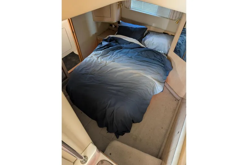 Slide: The Image of Bathroom interior of 2000 Sea Ray 420 Aft Cabin yacht, featuring sink and toilet. - 14