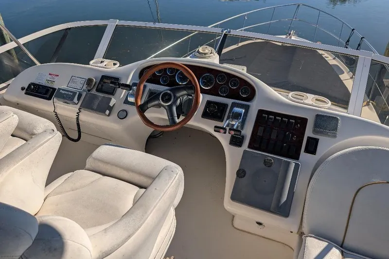 Slide: The Image of Cockpit of 2000 Sea Ray 420 Aft Cabin yacht with steering wheel and control panel. - 7