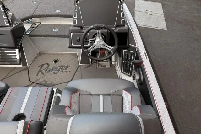 Slide: The Image of 2026 Ranger Z519R boat interior with steering wheel and seating. - 81