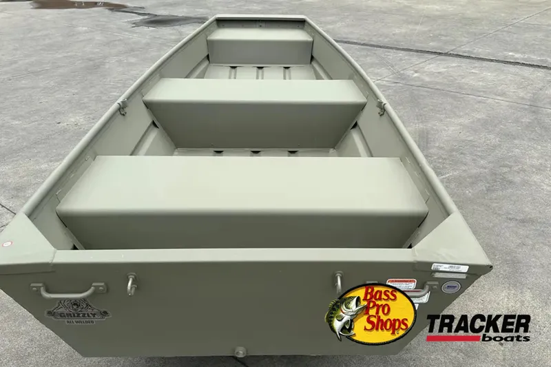 Slide: The Image of Tracker Grizzly 12 Jon boat 2026 on concrete surface. - 2