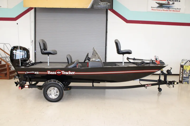 The Image of 2026 Tracker Bass Tracker Classic XL fishing boat on display indoors. - 0