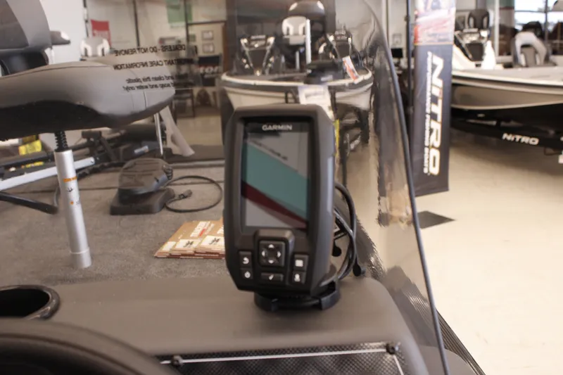Slide: The Image of 2026 Tracker Bass Tracker Classic XL with Garmin fishfinder in showroom. - 13