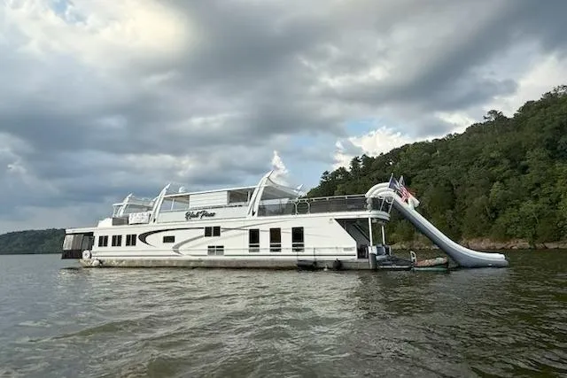 The Image of 2008 Sharpe 105 Custom houseboat with slide on a tranquil lake. - 0