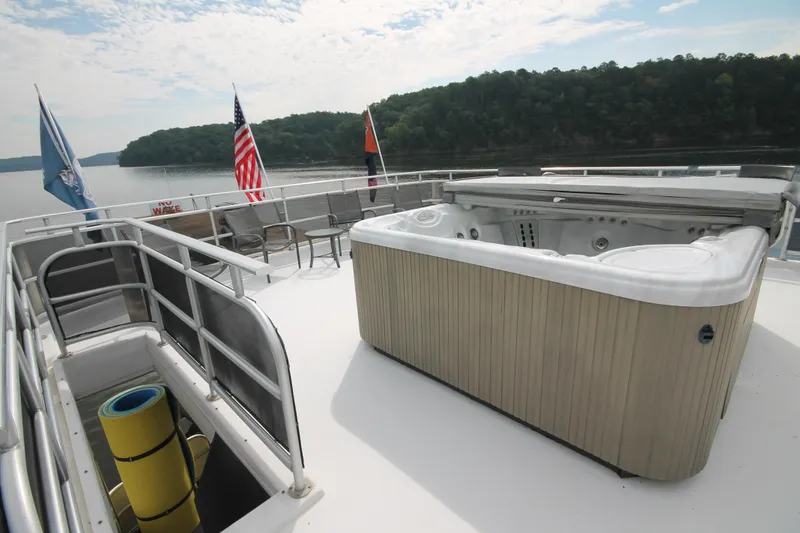 Slide: The Image of 2008 Sharpe 105 Custom Houseboat deck with hot tub and scenic lake view. - 27