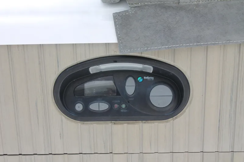 Slide: The Image of Control panel on 2008 Sharpe 105 Custom Houseboat, featuring various buttons and dials. - 28