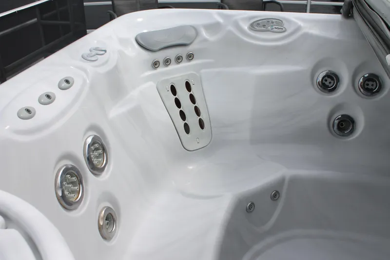 Slide: The Image of Luxurious hot tub on 2008 Sharpe 105 Custom Houseboat, featuring multiple jets and controls. - 29