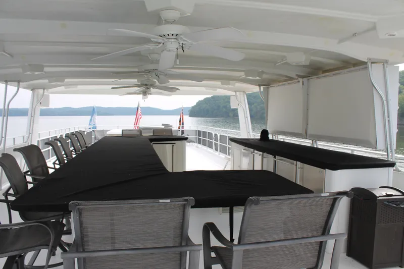 Slide: The Image of Spacious deck of 2008 Sharpe 105 Custom Houseboat with seating and scenic lake view. - 30