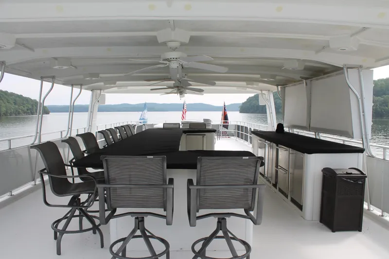 Slide: The Image of Spacious deck of 2008 Sharpe 105 Custom Houseboat with seating and scenic lake view. - 31