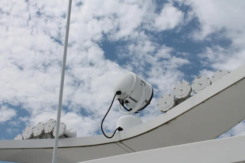 Slide: The Image of Spotlight and equipment on 2008 Sharpe 105 Custom Houseboat against cloudy sky. - 37