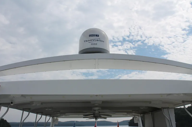 Slide: The Image of 2008 Sharpe 105 Custom Houseboat with TracVision satellite dome under cloudy sky. - 40