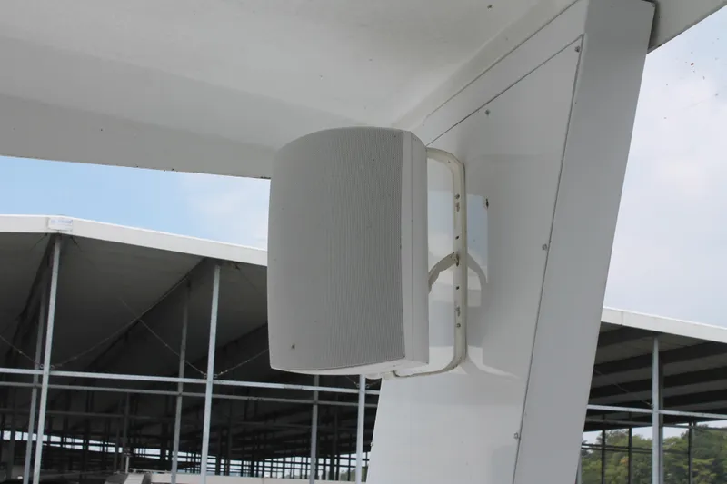Slide: The Image of Outdoor speaker mounted on 2008 Sharpe 105 Custom Houseboat, with marina background. - 41