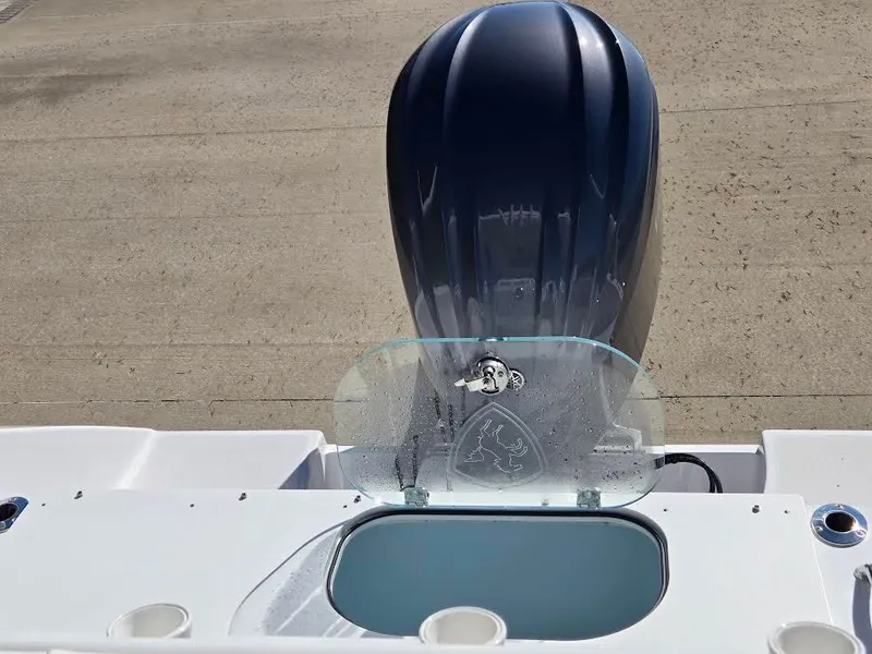 Slide: The Image of 2024 Century 2300 Center Console boat motor and control area. - 10