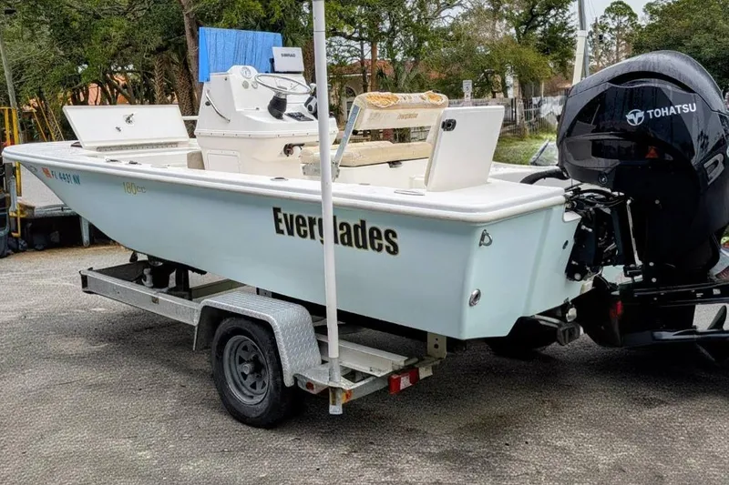 Slide: The Image of 2004 Everglades 180 Center Console boat on trailer with Tohatsu outboard motor. - 0