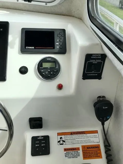 Slide: The Image of Dashboard of a 2017 Parker 2520 XL Sport Cabin boat. - 12