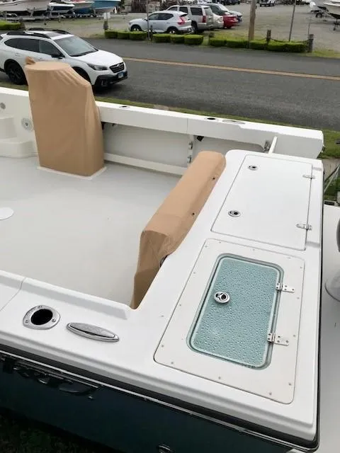 Slide: The Image of Parker 2520 XL Sport Cabin 2017, boat deck view, harbor in background. - 21