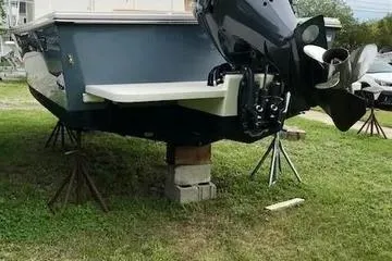 Slide: The Image of 2017 Parker 2520 XL Sport Cabin boat on stands, rear view. - 25