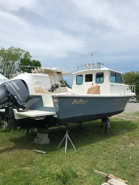 Slide: The Image of 2017 Parker 2520 XL Sport Cabin boat on stands. - 3