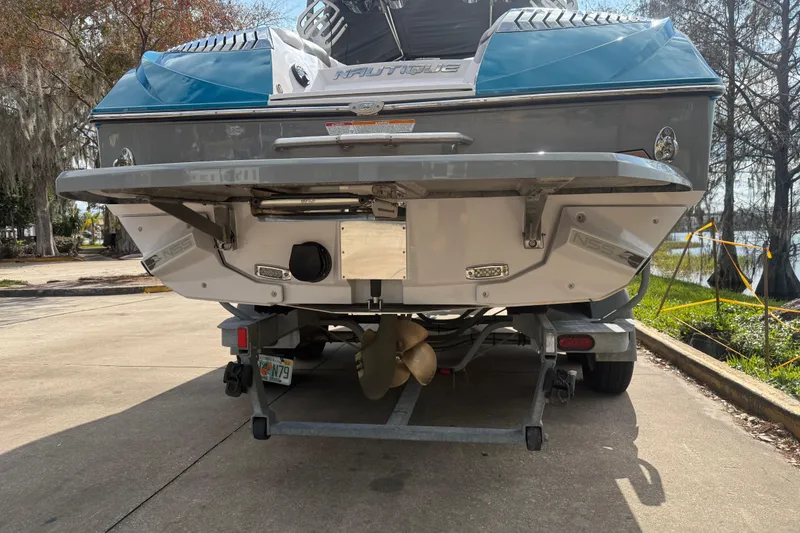 Slide: The Image of 2013 Nautique Super Air Nautique G23 Coastal Edition on trailer, rear view. - 3