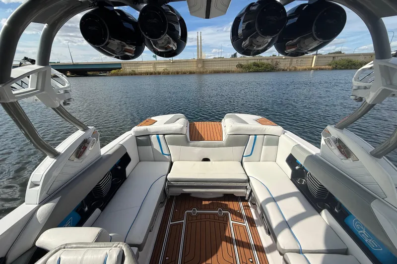 Slide: The Image of 2013 Nautique Super Air Nautique G23 Coastal Edition interior with luxurious seating and speakers. - 6