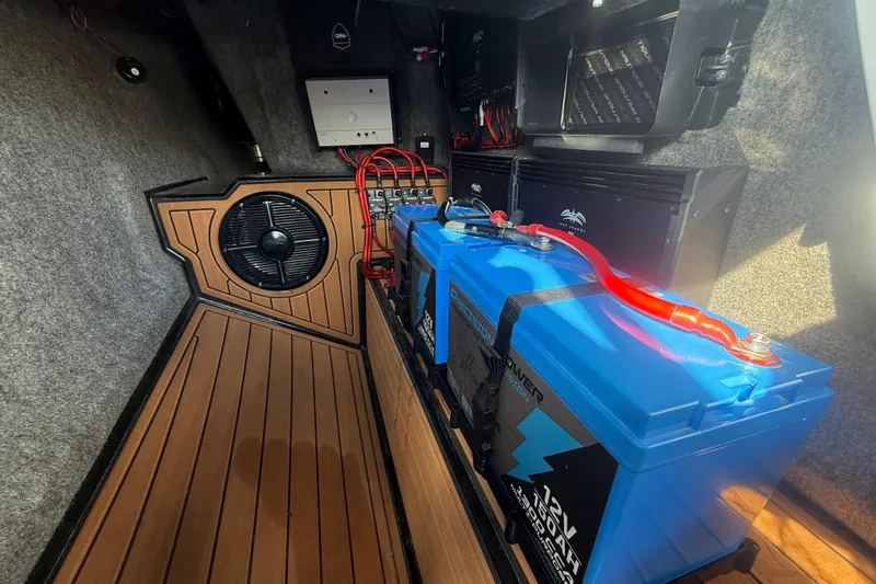 Slide: The Image of Interior of 2013 Nautique Super Air Nautique G23 Coastal Edition with batteries and wiring. - 8