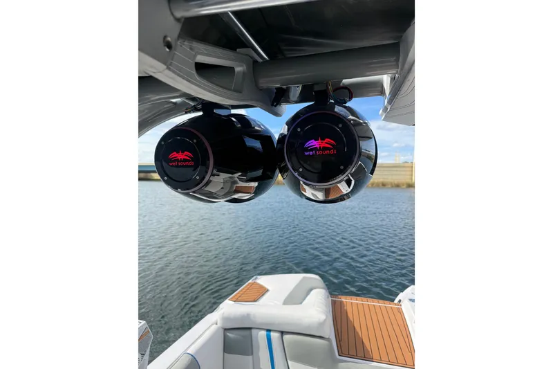 Slide: The Image of 2013 Nautique Super Air Nautique G23 Coastal Edition with Wet Sounds speakers on a boat. - 9