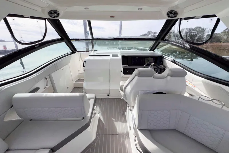 Slide: The Image of Interior of 2022 Sea Ray Sundancer 320 yacht with modern seating and helm. - 11