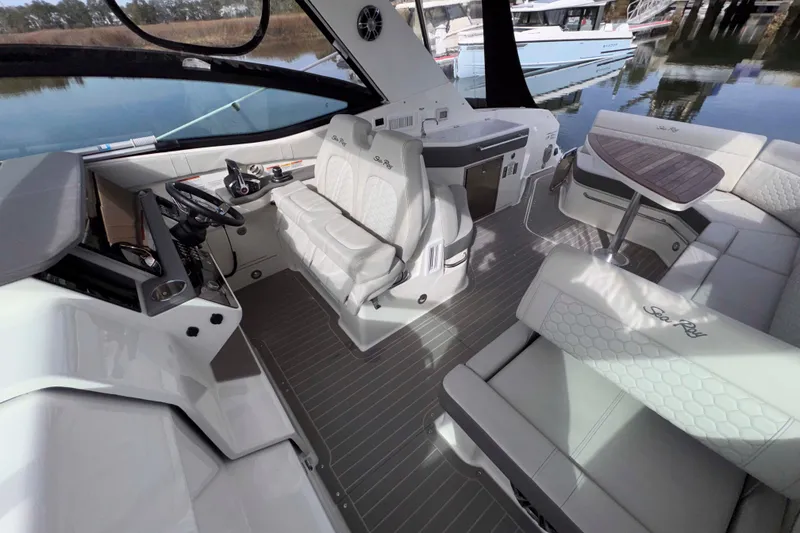 Slide: The Image of 2022 Sea Ray Sundancer 320 interior with luxurious seating and modern helm. - 20
