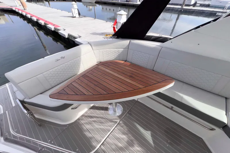 Slide: The Image of Luxurious seating area on 2022 Sea Ray Sundancer 320 yacht with wooden table. - 25