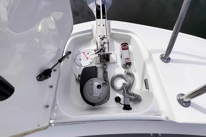 Slide: The Image of Anchor system on 2022 Sea Ray Sundancer 320 boat deck, featuring winch and controls. - 29