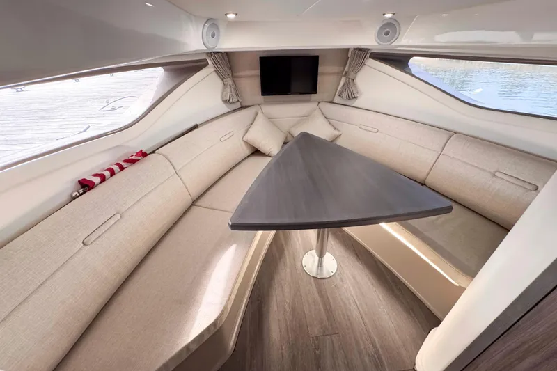 Slide: The Image of Luxurious interior of 2022 Sea Ray Sundancer 320 with elegant seating and modern table. - 31