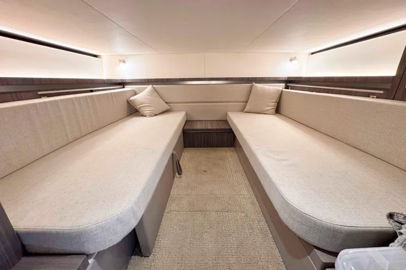 Slide: The Image of 2022 Sea Ray Sundancer 320 cabin interior with beige seating and modern design. - 34