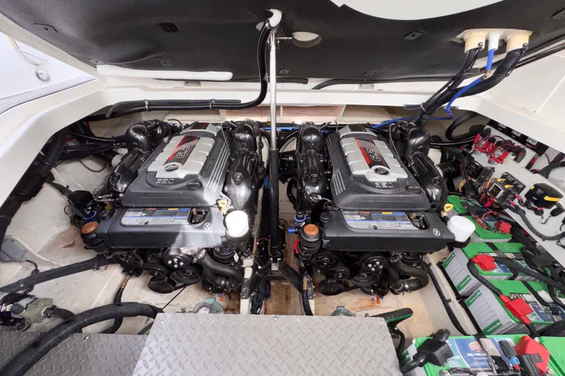 Slide: The Image of Engine room of 2022 Sea Ray Sundancer 320 with dual engines and battery setup. - 38
