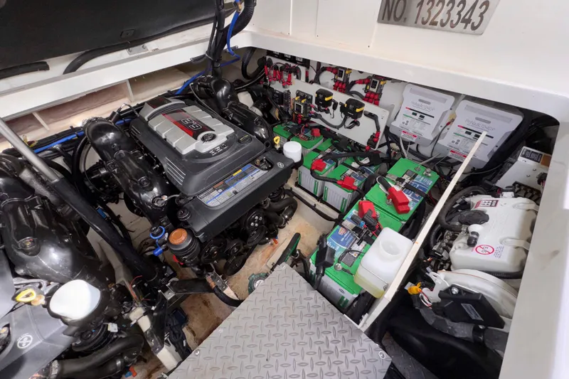 Slide: The Image of Engine compartment of 2022 Sea Ray Sundancer 320 with batteries and wiring. - 39