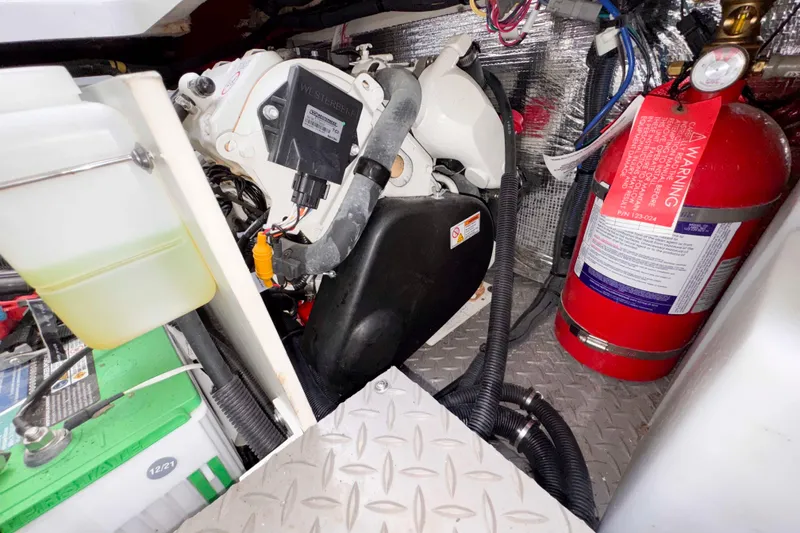 Slide: The Image of Engine compartment of 2022 Sea Ray Sundancer 320 with fire extinguisher and wiring. - 40