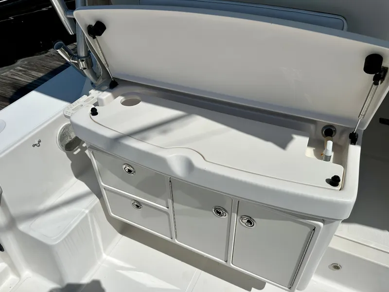 Slide: The Image of 2005 Tiara Yachts 3600 Open boat storage compartment with open lid and drawers. - 12