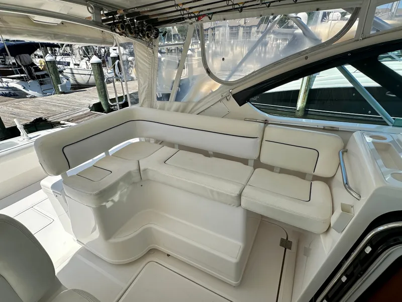 Slide: The Image of 2005 Tiara Yachts 3600 Open interior with white seating and fishing rod holders. - 15