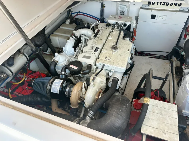 Slide: The Image of Engine compartment of a 2005 Tiara Yachts 3600 Open, showcasing detailed mechanical components. - 27