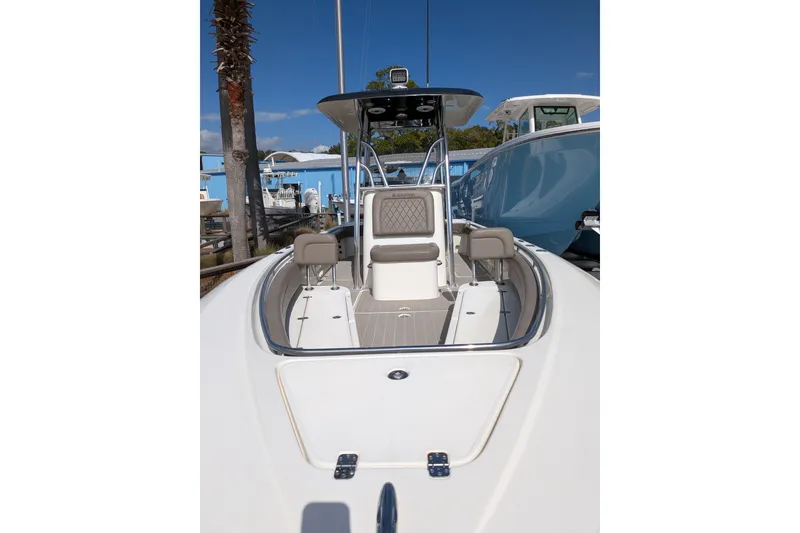 Slide: The Image of Luxury seating on a 2012 Blackwood 27 boat, featuring dual engines and marina backdrop. - 2