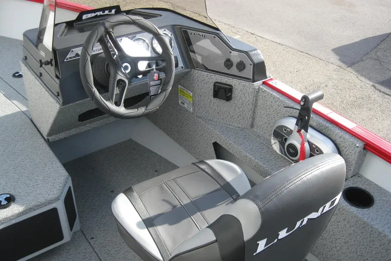 Slide: The Image of 2024 Lund 1775 Adventure SS boat interior with seating and storage compartments. - 11