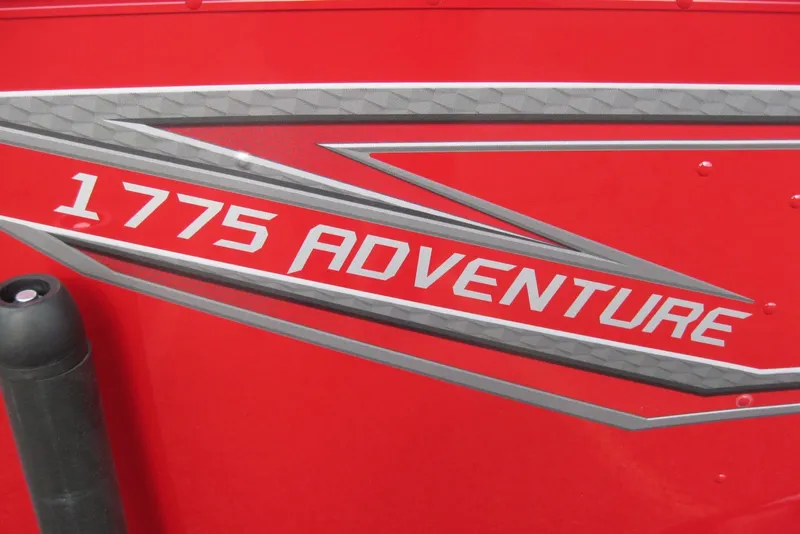 Slide: The Image of Red 2024 Lund 1775 Adventure SS boat with bold logo. - 3