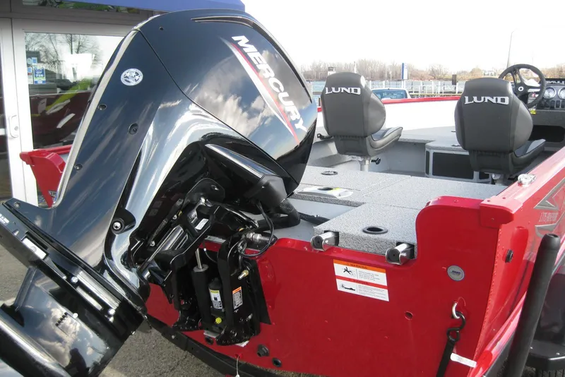 Slide: The Image of Red 2024 Lund 1775 Adventure SS boat with bold graphics. - 4