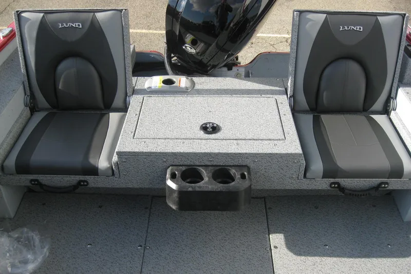 Slide: The Image of 2024 Lund 1775 Adventure SS boat interior with storage compartments and motor mount. - 8
