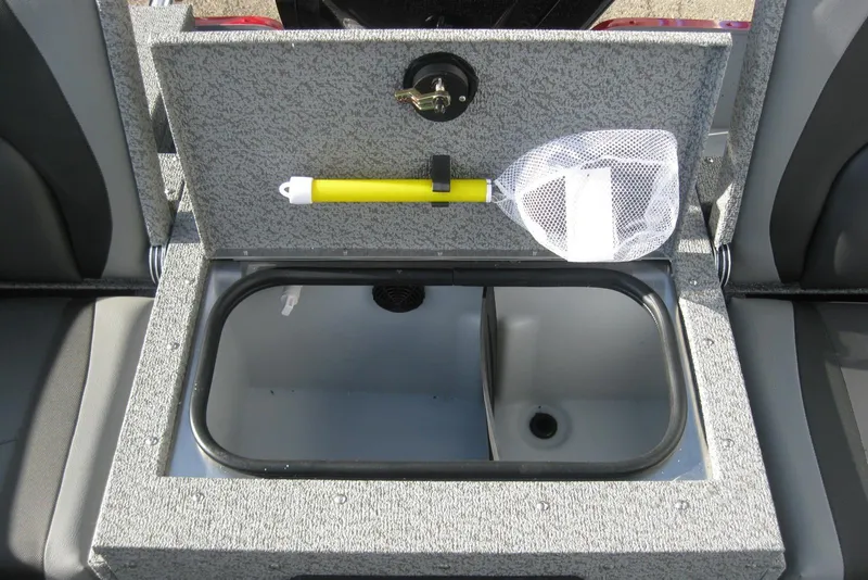 Slide: The Image of 2024 Lund 1775 Adventure SS boat interior with two gray seats and storage compartment. - 9