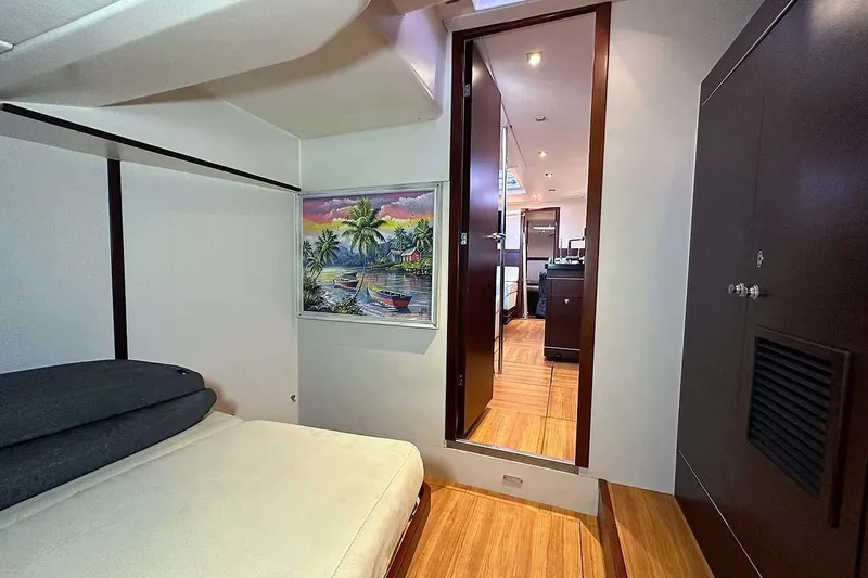 Slide: The Image of Interior of 2010 Hanse 545 yacht cabin with bed, artwork, and wooden flooring. - 18